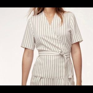 Aritzia “Kaltag” wrap blouse in cream and black